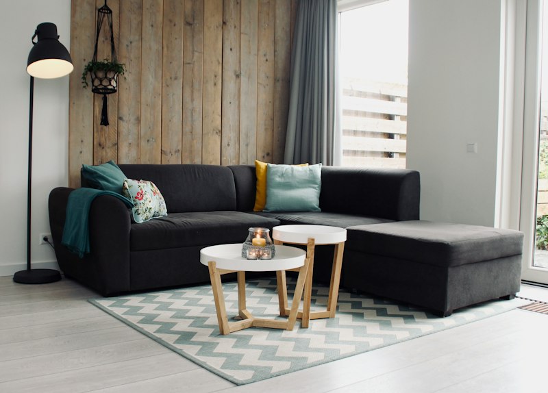 A sectional sofa with round coffee tables